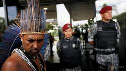 Medium_file-photo--an-indigenous-man-is-seen-as-he-wants-to-deliver-a-letter-to-brazil-s-president-elect-jair-bolsonaro-at-a-transitional-government-building-in-brasilia-1
