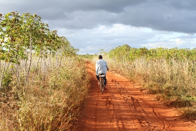 Large_mozambique_man-cycling-dirt-road-nacala-corridor_grain